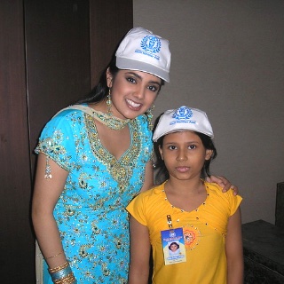 A woman and child wearing Kochi Konther Asar caps