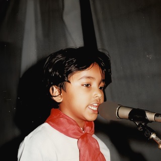 A child singing at a microphone